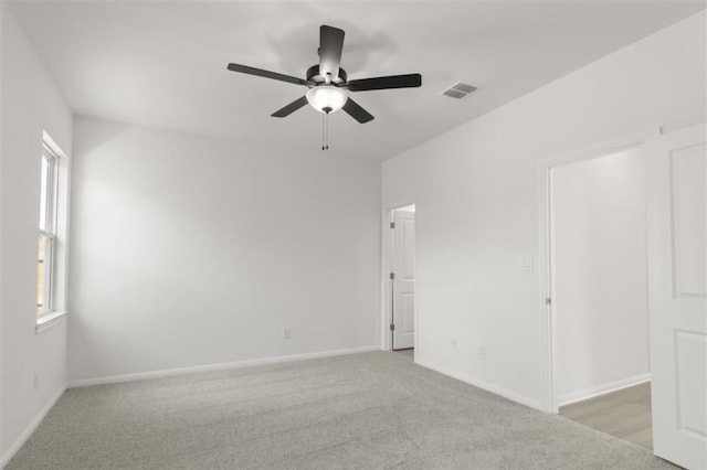 168 Bosque Dr, San Marcos, TX 78666 - carpeted empty room with ceiling fan, plenty of natural light, and baseboards