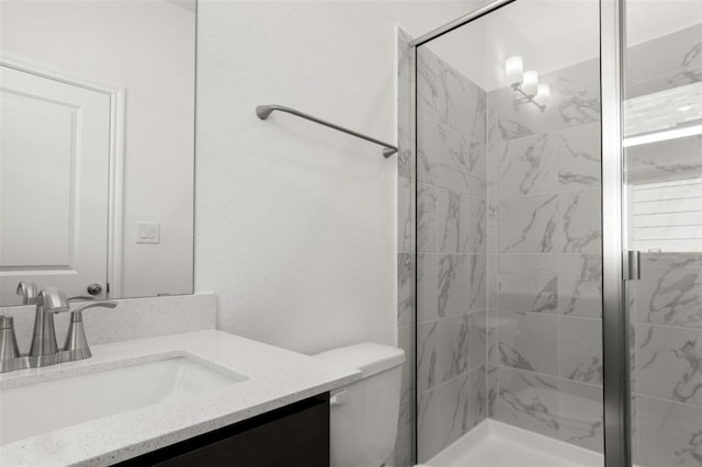 168 Bosque Dr, San Marcos, TX 78666 - bathroom with vanity, a shower stall, and toilet