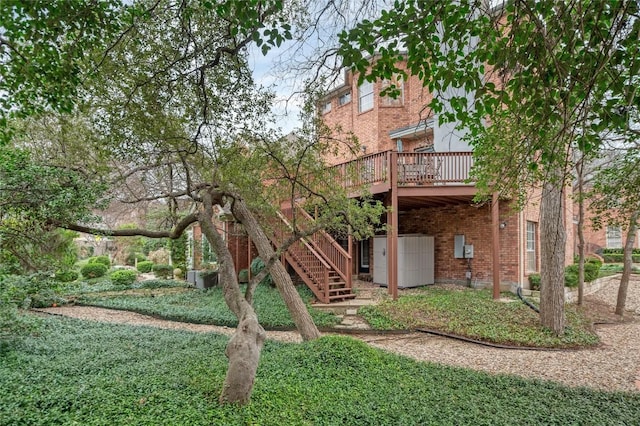 2716 Hillview Green Ln, Austin, TX 78703 - back of property with stairs, brick siding, and a wooden deck
