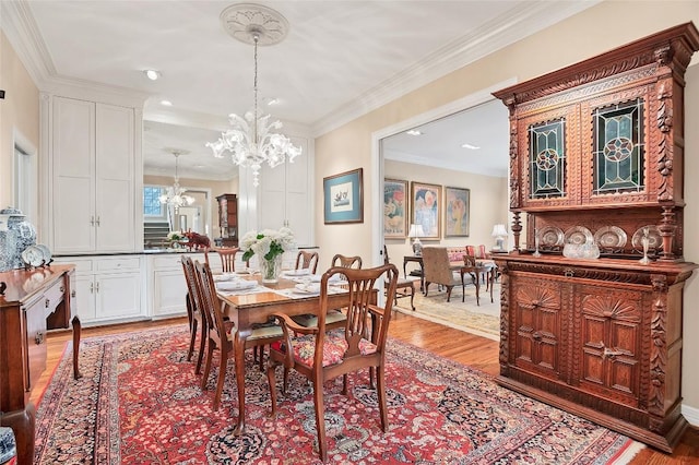 2716 Hillview Green Ln, Austin, TX 78703 - dining area featuring a chandelier, light wood finished floors, and crown molding