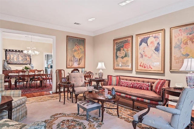 living room featuring hardwood / wood-style floors, an inviting chandelier, and crown molding