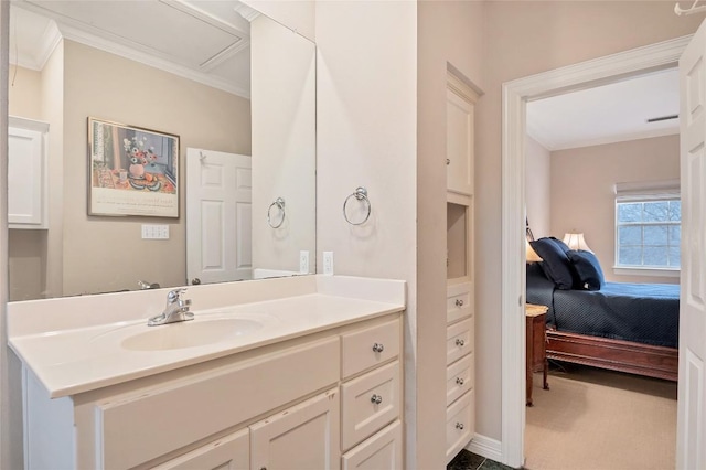 bathroom featuring crown molding and vanity