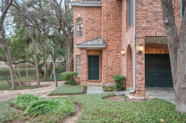 2716 Hillview Green Ln, Austin, TX 78703 - entrance to property with brick siding, a standing seam roof, and driveway