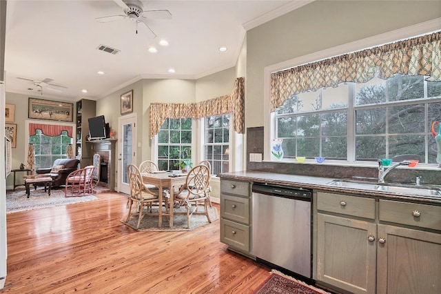 kitchen with light hardwood / wood-style flooring, sink, ornamental molding, stainless steel dishwasher, and ceiling fan