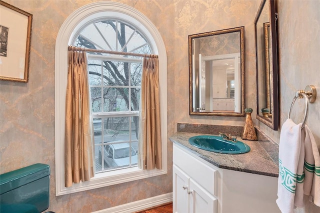 2716 Hillview Green Ln, Austin, TX 78703 - bathroom featuring wallpapered walls, vanity, baseboards, and toilet