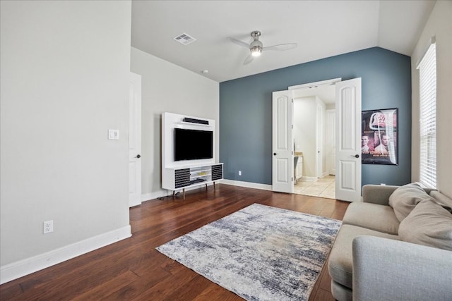 living room with vaulted ceiling, hardwood / wood-style floors, and ceiling fan