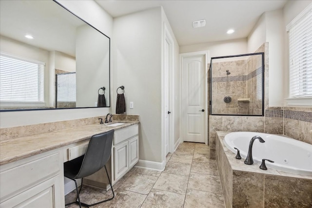 bathroom featuring tile patterned floors, vanity, and shower with separate bathtub