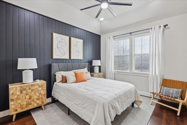 bedroom featuring lofted ceiling, hardwood / wood-style floors, and ceiling fan