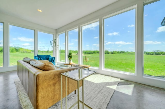 sunroom / solarium with a rural view