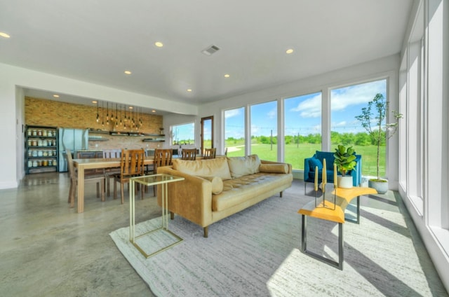 living room featuring concrete flooring