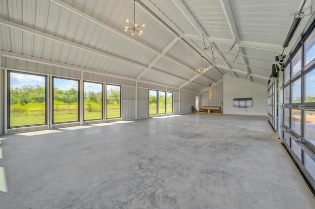 unfurnished living room with concrete floors and lofted ceiling