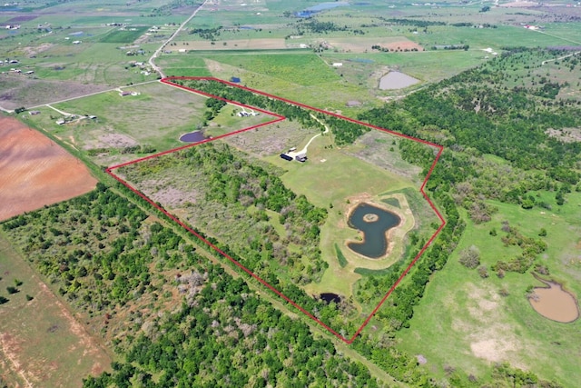 birds eye view of property featuring a rural view