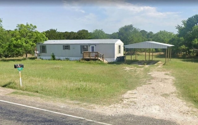 manufactured / mobile home featuring a carport