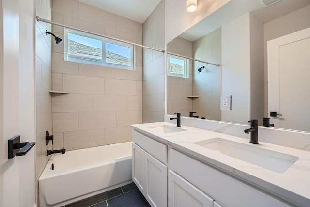 bathroom with double vanity, a sink, and bathing tub / shower combination