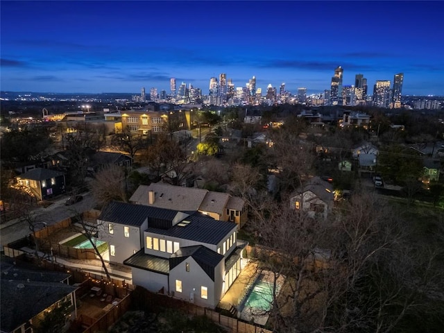 aerial view at dusk with a city view