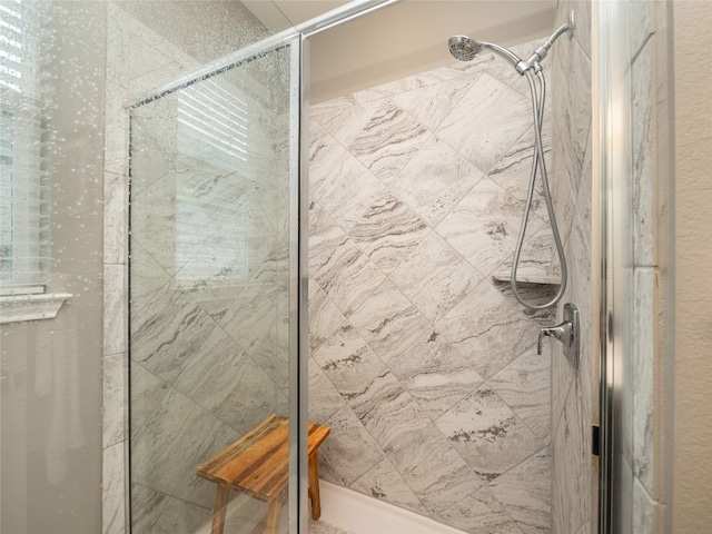 bathroom with a tile shower