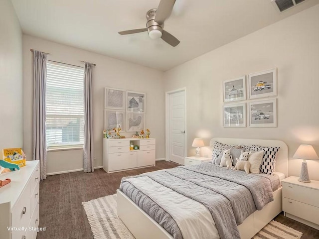 1432 Uhland Dr, Leander, TX 78641 - bedroom with dark colored carpet, baseboards, and a ceiling fan