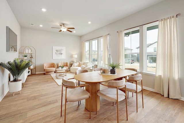 dining space featuring ceiling fan and light hardwood / wood-style floors