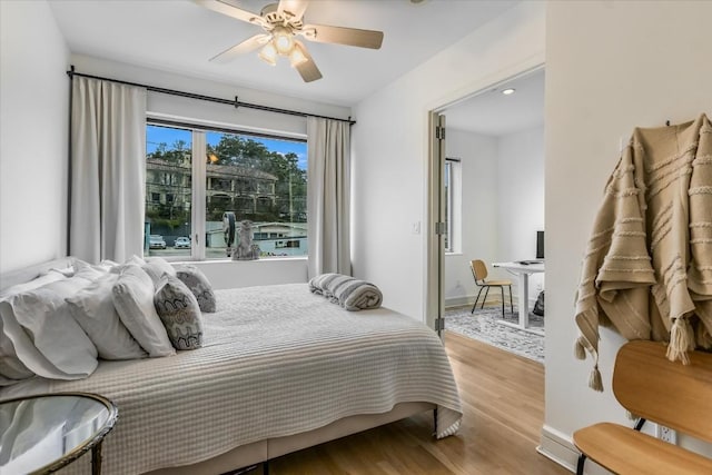 bedroom featuring light hardwood / wood-style flooring and ceiling fan