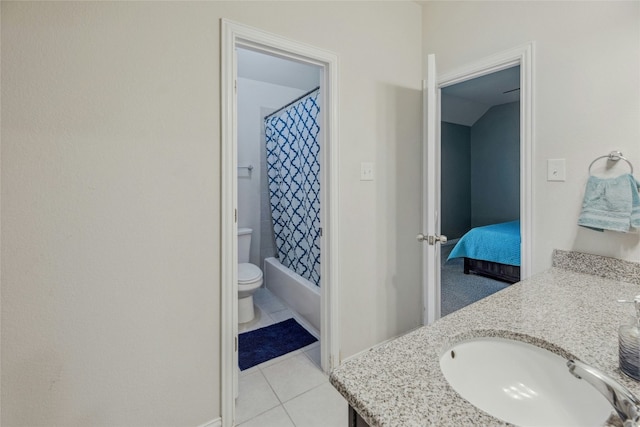 ensuite bathroom featuring connected bathroom, toilet, tile patterned floors, shower / bath combination with curtain, and vanity