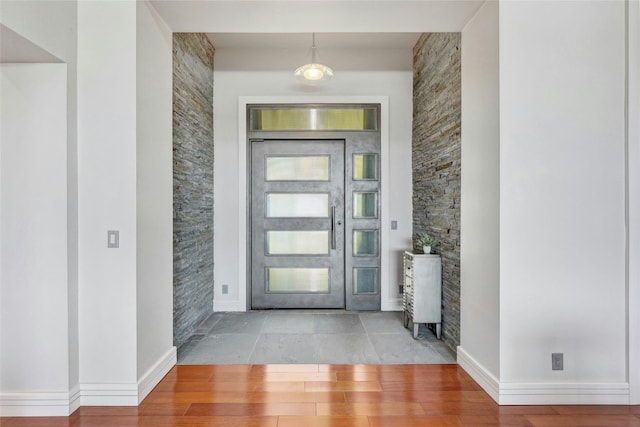 702 Crystal Mountain Dr, Austin, TX 78733 - foyer entrance with baseboards and wood finished floors