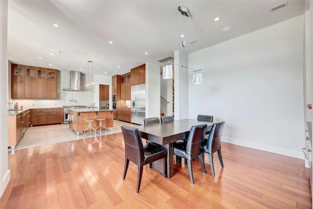 702 Crystal Mountain Dr, Austin, TX 78733 - dining space featuring light wood-style flooring and recessed lighting