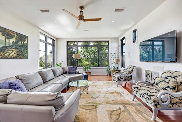 702 Crystal Mountain Dr, Austin, TX 78733 - living area featuring wood finished floors, a ceiling fan, plenty of natural light, and recessed lighting