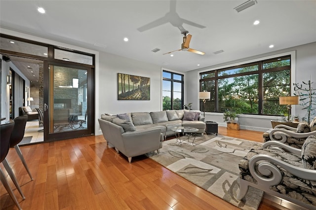 702 Crystal Mountain Dr, Austin, TX 78733 - living room featuring wood finished floors, a ceiling fan, recessed lighting, and plenty of natural light