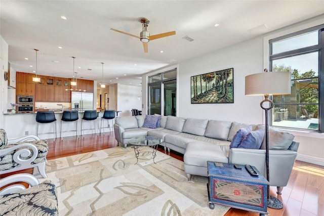 702 Crystal Mountain Dr, Austin, TX 78733 - living room with a ceiling fan, recessed lighting, and light wood-style floors