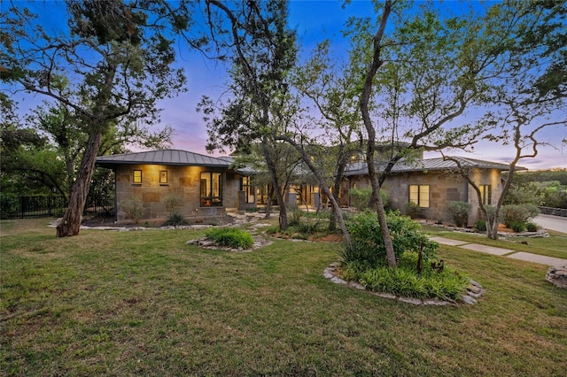 702 Crystal Mountain Dr, Austin, TX 78733 - view of front facade with stone siding, a standing seam roof, and a metal roof