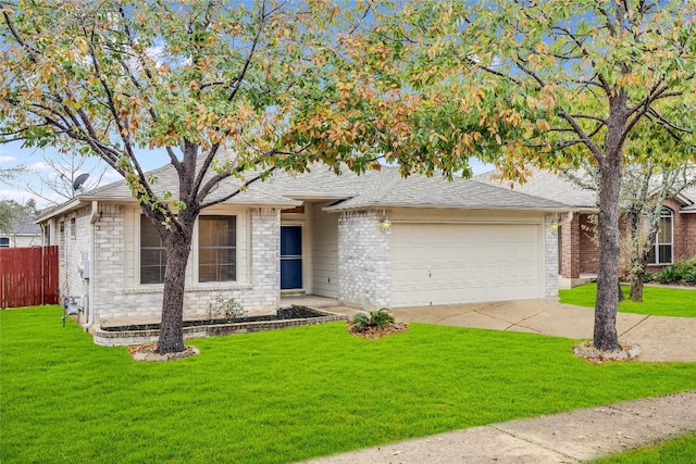 view of front of house with a front lawn and a garage