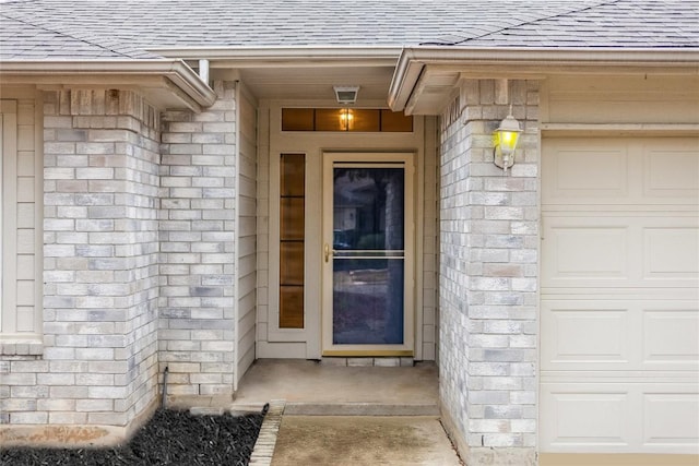 doorway to property featuring a garage