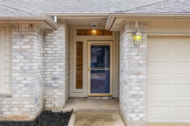 3580 Rock Shelf Ln, Round Rock, TX 78681 - entrance to property featuring a shingled roof, stone siding, and a garage