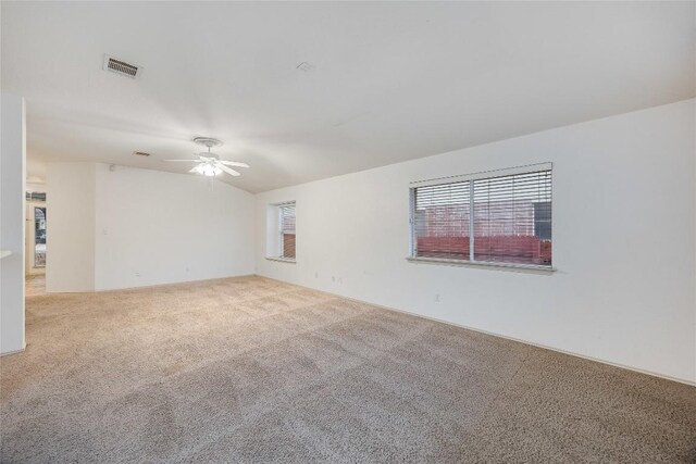3580 Rock Shelf Ln, Round Rock, TX 78681 - carpeted empty room featuring healthy amount of natural light and a ceiling fan