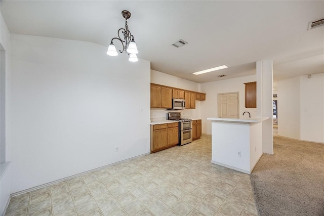3580 Rock Shelf Ln, Round Rock, TX 78681 - kitchen with stainless steel appliances, brown cabinets, light countertops, a chandelier, and pendant lighting