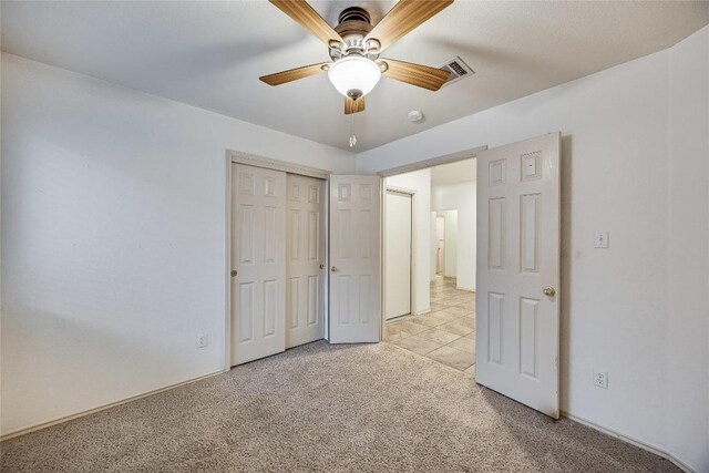 3580 Rock Shelf Ln, Round Rock, TX 78681 - unfurnished bedroom with light carpet, a closet, and ceiling fan