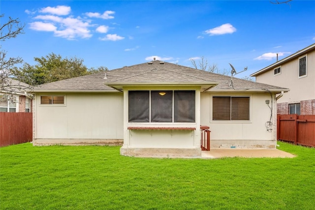 back of property featuring a yard