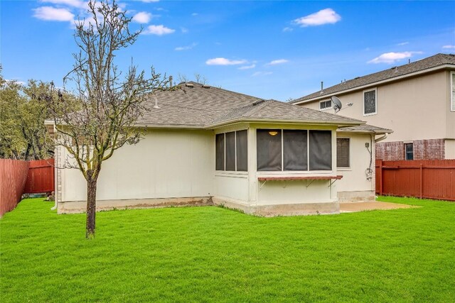 3580 Rock Shelf Ln, Round Rock, TX 78681 - rear view of house featuring a fenced backyard, a sunroom, and a shingled roof