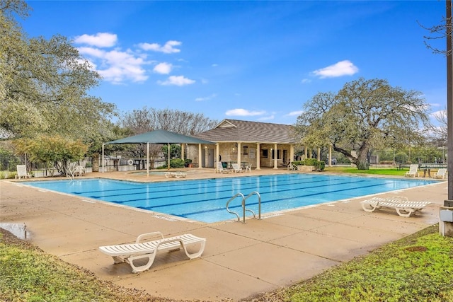 view of swimming pool with a patio