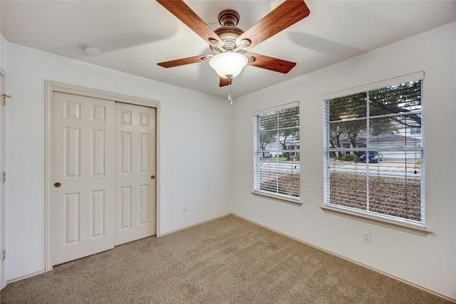 3580 Rock Shelf Ln, Round Rock, TX 78681 - unfurnished bedroom with carpet flooring, a closet, and a ceiling fan