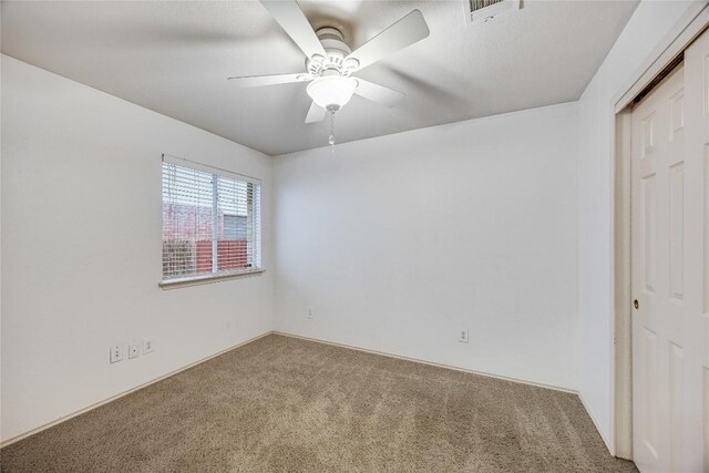 3580 Rock Shelf Ln, Round Rock, TX 78681 - unfurnished bedroom featuring carpet, a closet, and a ceiling fan
