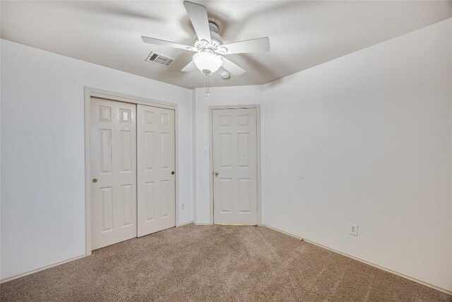 3580 Rock Shelf Ln, Round Rock, TX 78681 - unfurnished bedroom with carpet flooring, a closet, and ceiling fan