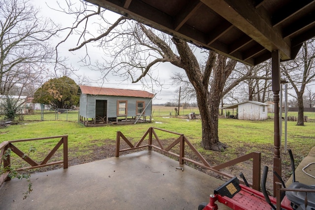 view of patio with a storage shed