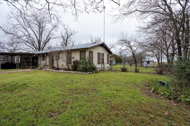 view of side of property featuring a yard