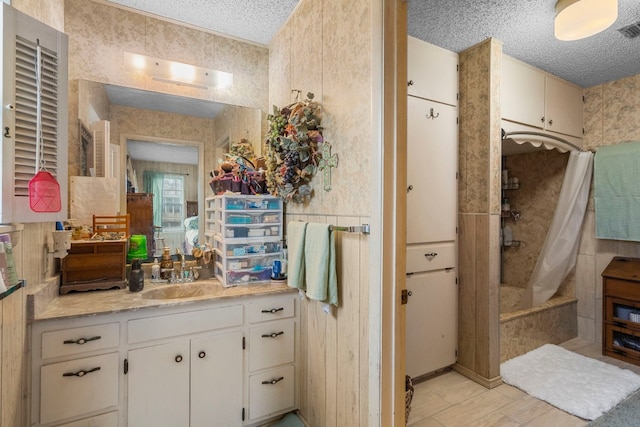 bathroom featuring vanity and a textured ceiling