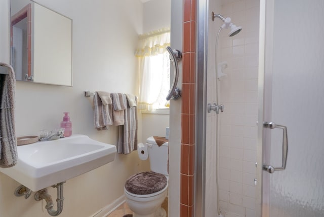 bathroom with toilet and walk in shower