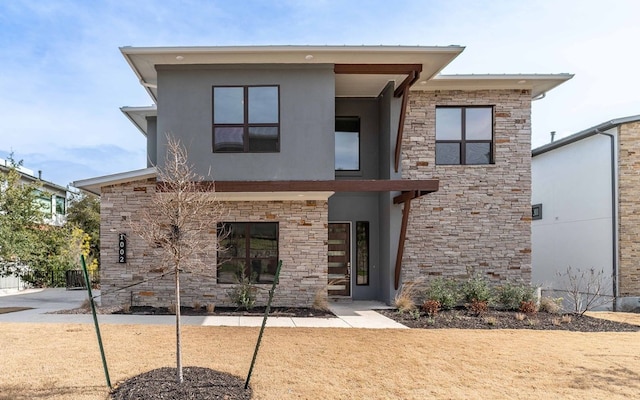 1002 Barrie Dr, Austin, TX 78734 - back of property featuring stucco siding and stone siding