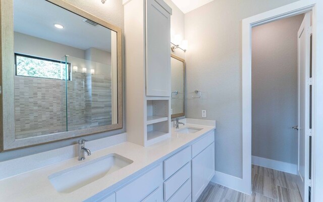 1002 Barrie Dr, Austin, TX 78734 - full bathroom with double vanity and tiled shower