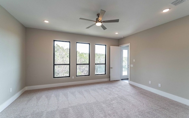 1002 Barrie Dr, Austin, TX 78734 - unfurnished room featuring plenty of natural light, ceiling fan, light carpet, and recessed lighting