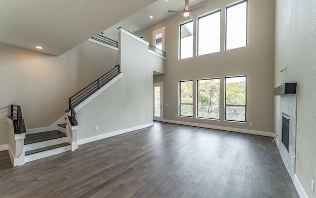 1002 Barrie Dr, Austin, TX 78734 - unfurnished living room with stairway, plenty of natural light, ceiling fan, a glass covered fireplace, and recessed lighting